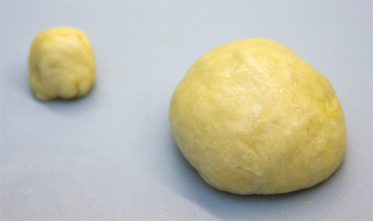 further dividing each ball of dough