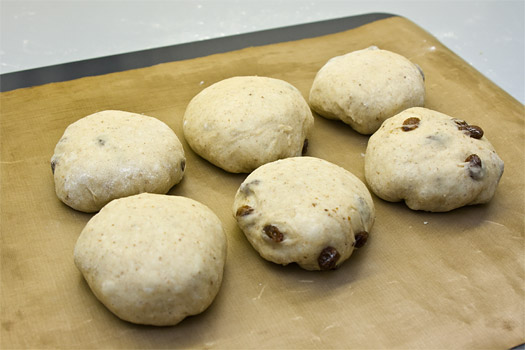 the shaped hot cross buns prior to the final rise
