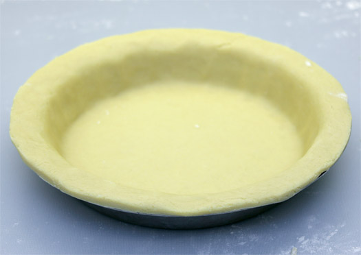 lining the pie dish with pastry