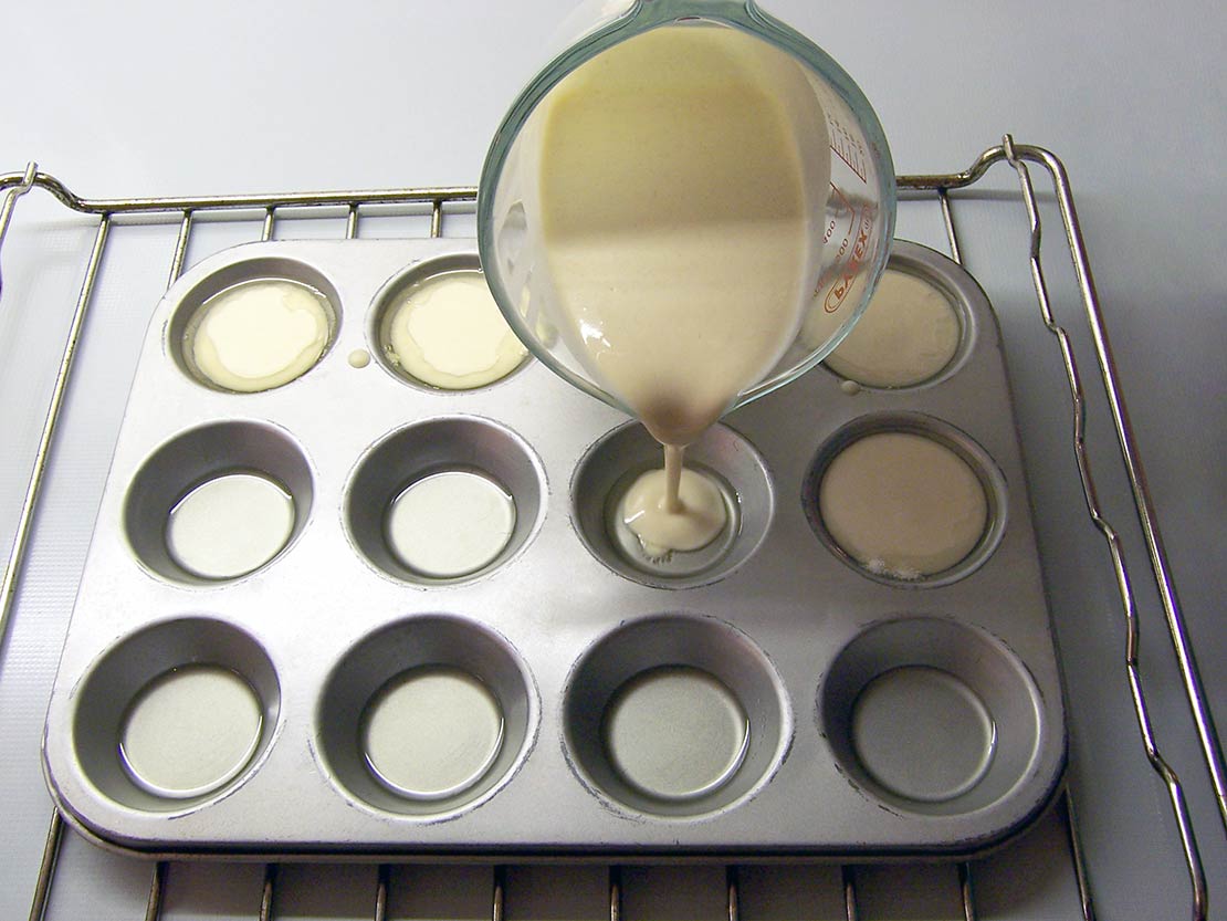 pouring into the muffin tray