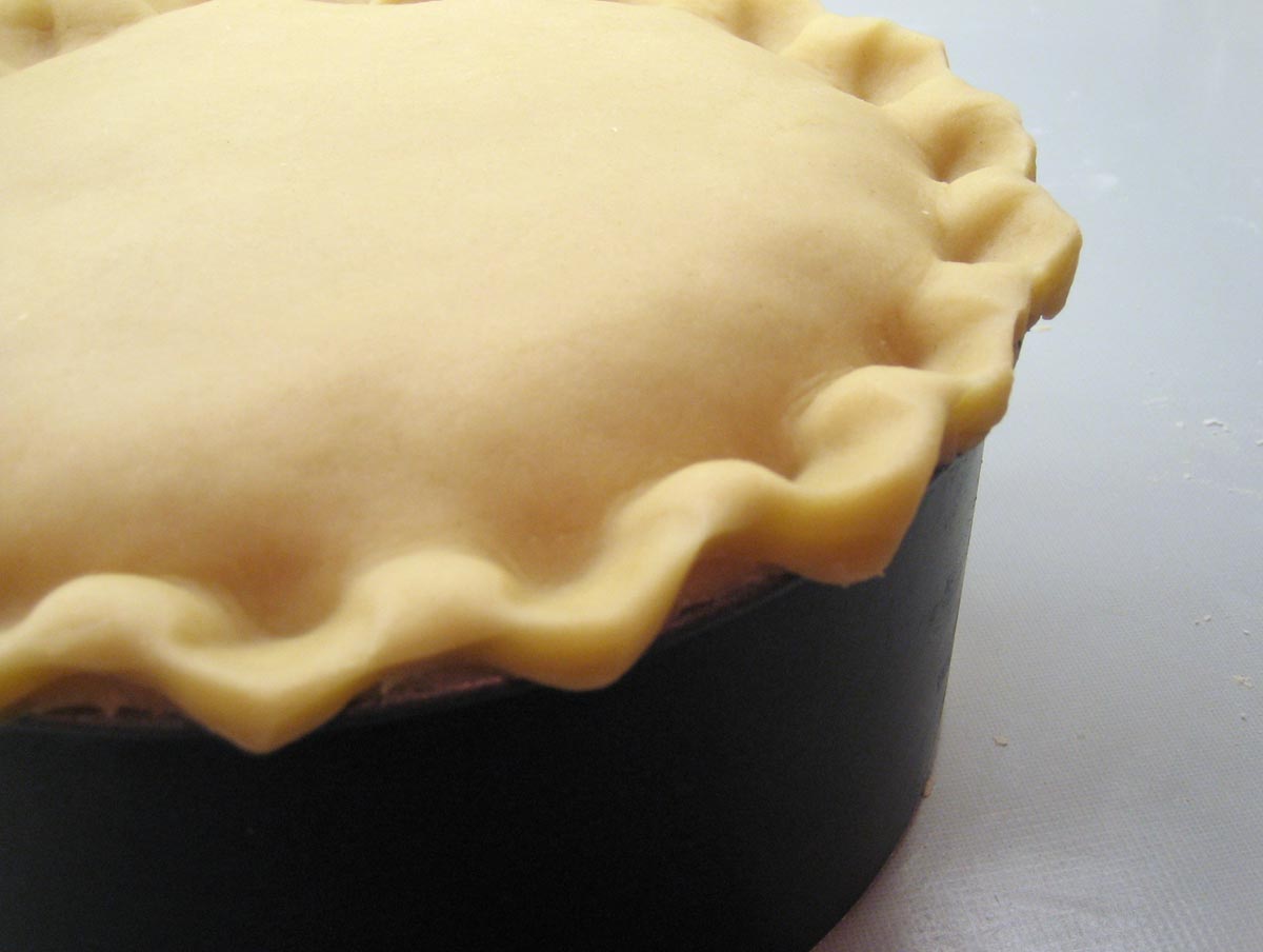 crimping the edges of the pastry