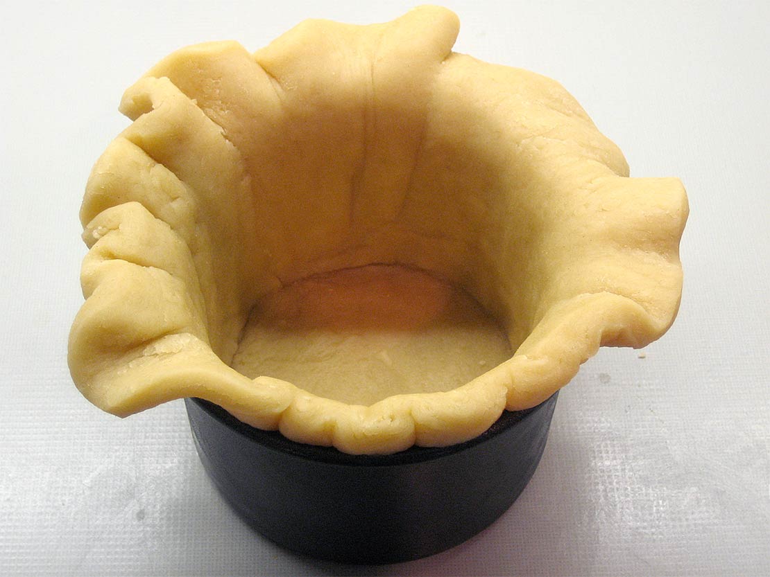 line the tin with the pastry