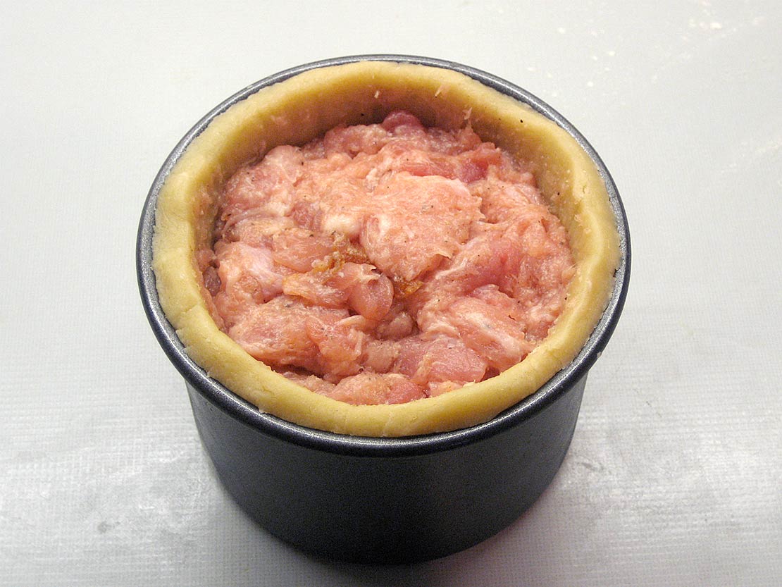 trim the pastry and fill with the meat