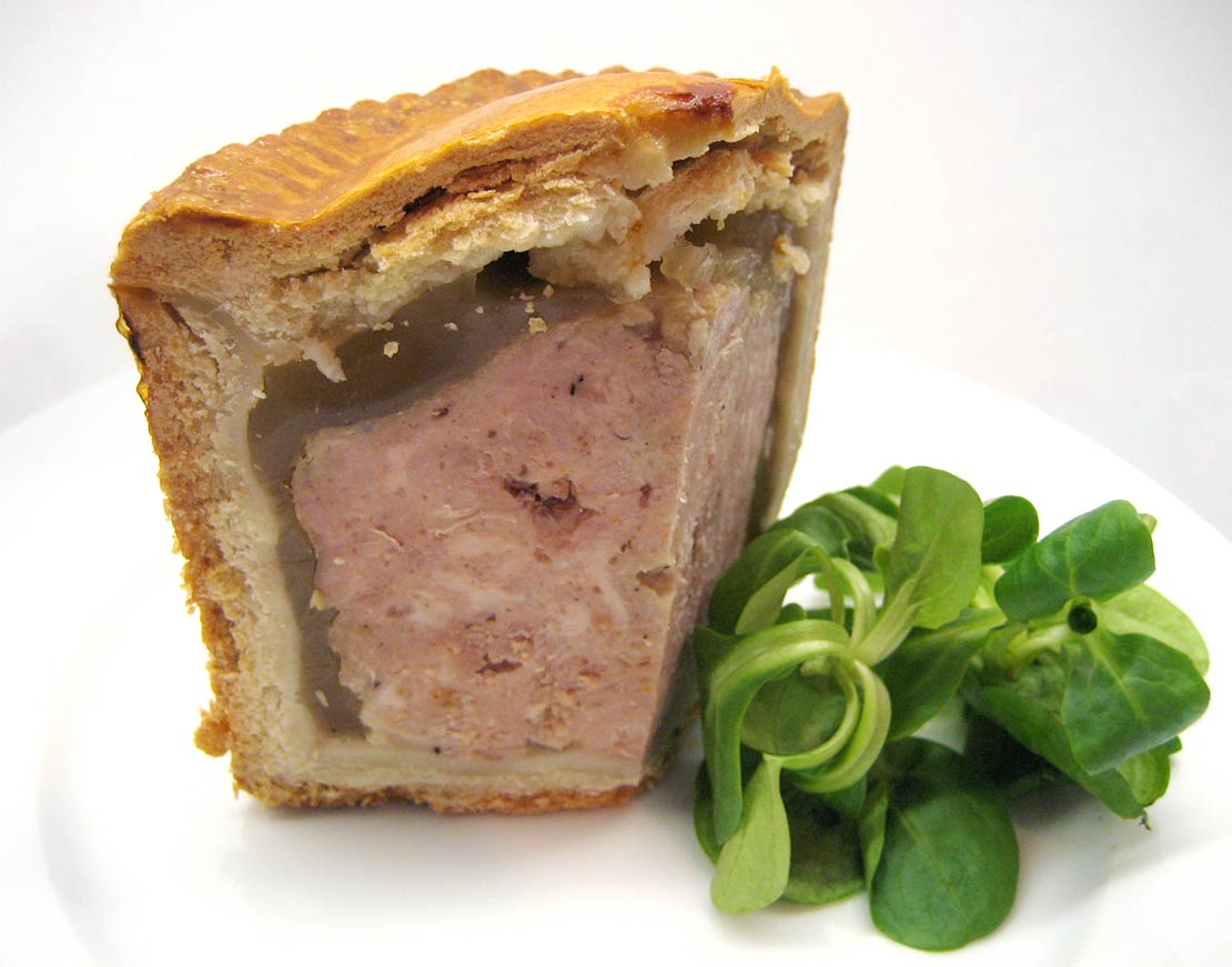a slice of the finished pork pie