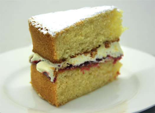 a slice of the finished victoria sponge