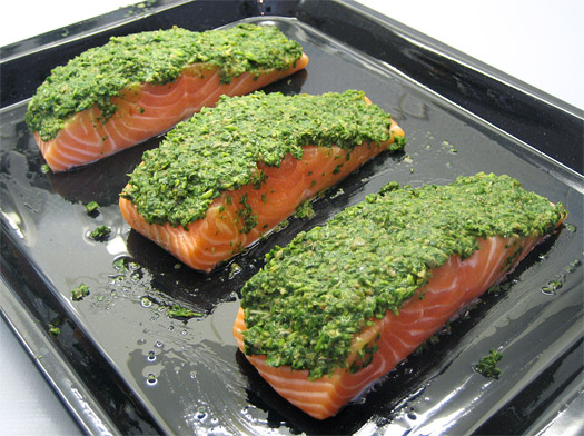 covering the top of the salmon with the salsa verdi